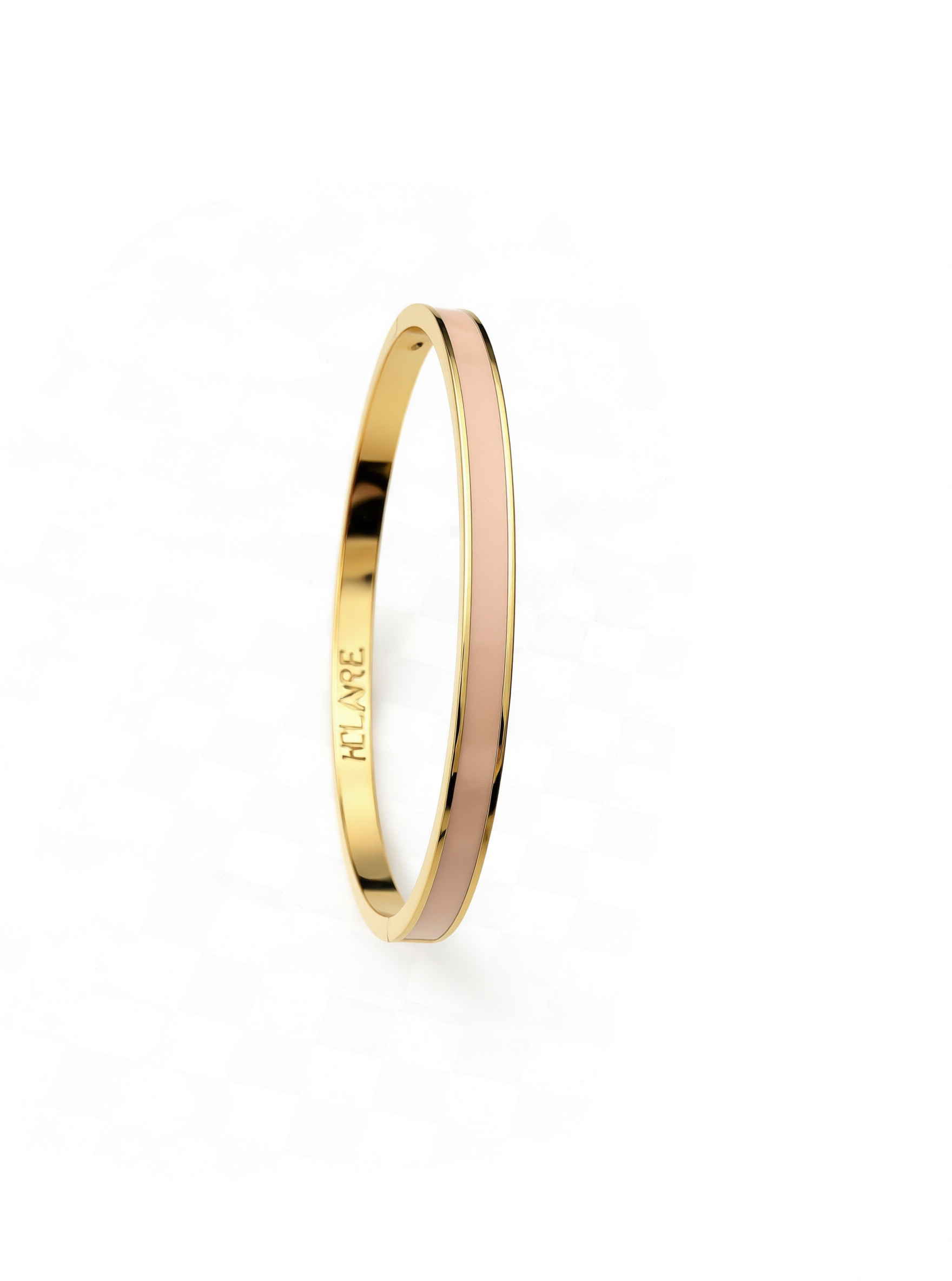 Layer bangle in 18k yellow gold with dusty pink enamel on a white background.